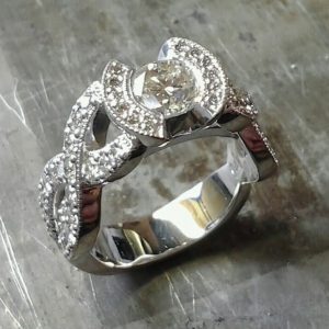 custom white gold ring with diamonds in infinity shape