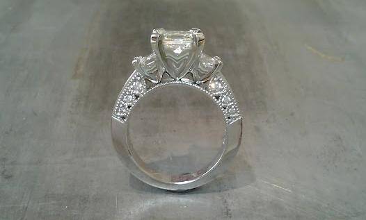 custom three stone engagement ring with 14k white gold and diamond accent band