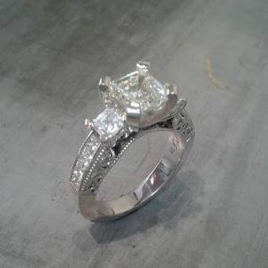 custom three stone engagement ring with 14k white gold and diamond accent band top view