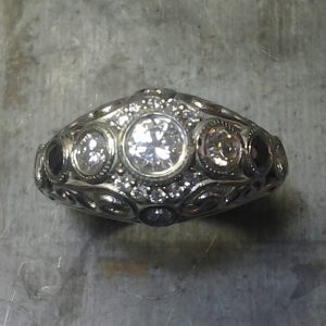 Open style Art deco inspired scroll engagement ring top view bezel