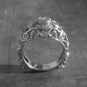 Open style Art deco inspired scroll engagement ring.