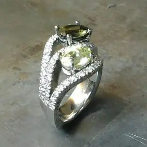 side view Colored gemstone multi-diamond encrusted ring.