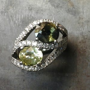 Colored gemstone multi-diamond encrusted ring.