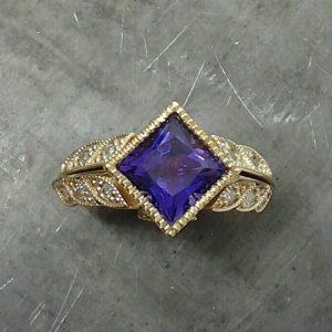Purple stone engagement ring diamond leaves