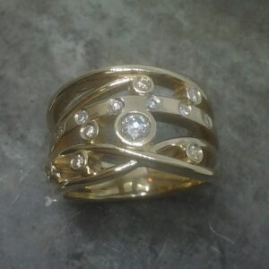 yellow gold crossover ring customer diamonds