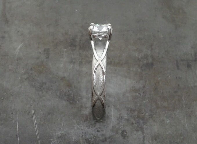 Sound wave 19k diamond engagement ring