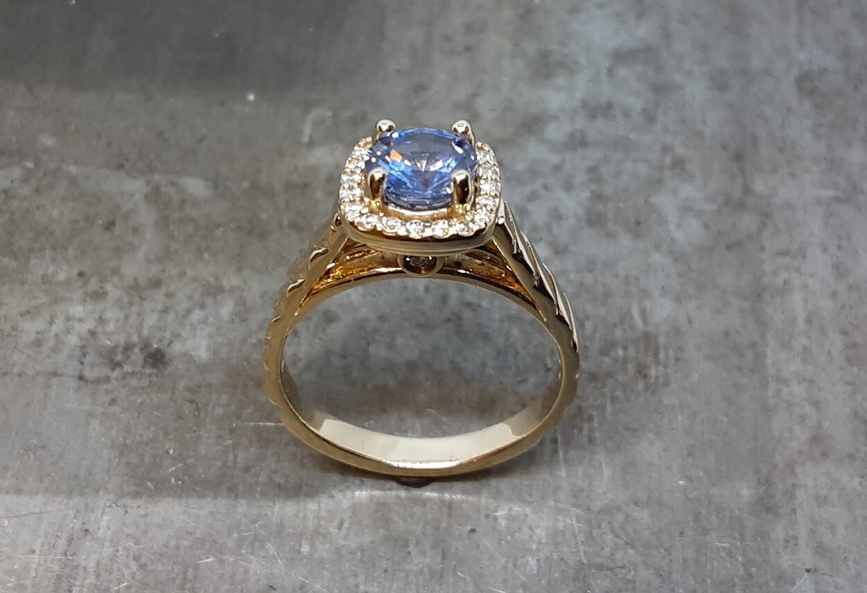 Light Blue AA Sapphire yellow gold with diamond halo