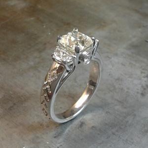 Indiginous half moon and round diamond engagement ring