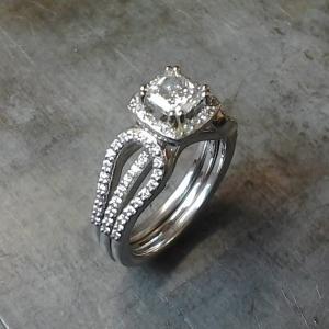 white gold curved shank halo diamond engagement ring