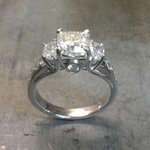 Indiginous half moon and round diamond engagement ring