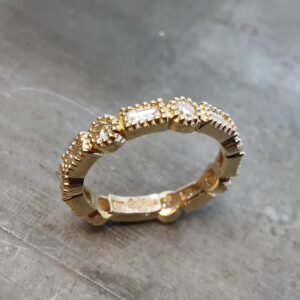 14k yellow gold round diamond and baguette millgrain ring