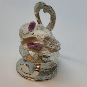 white gold treble clef sculpture red beryl